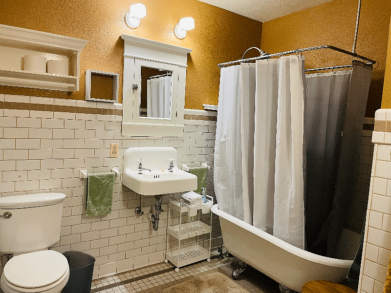 Full bathroom with clawfoot tub