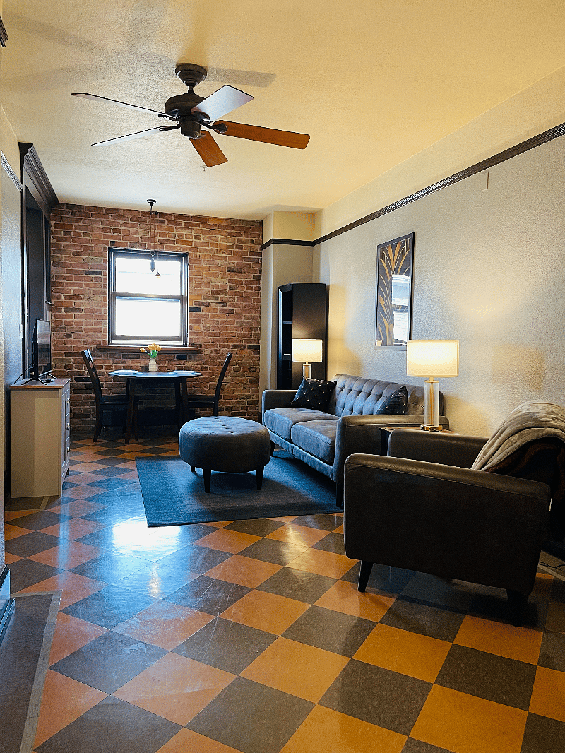 Living area with couch, chair and tv