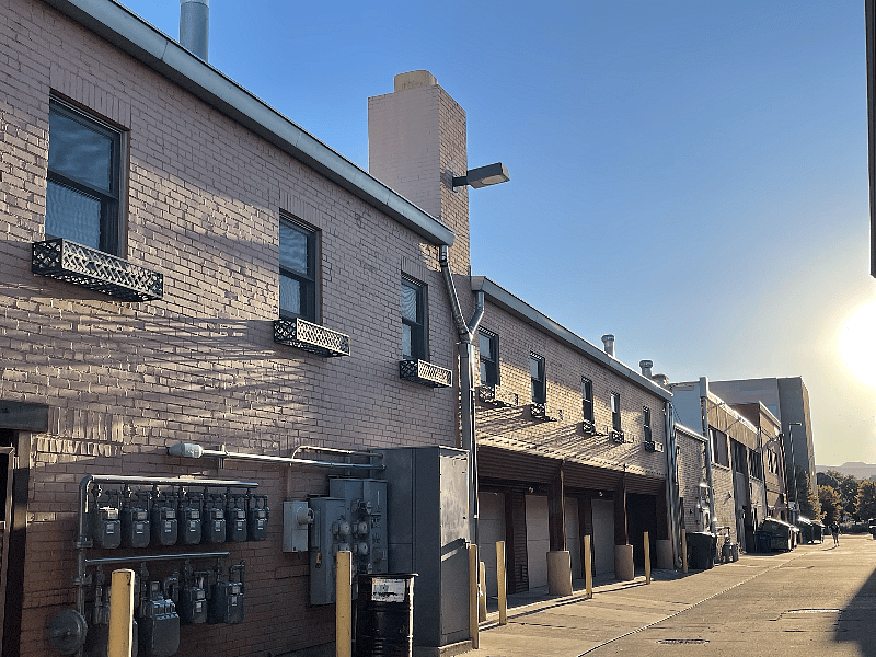 Alley at rear of building where entrance to garage is located
