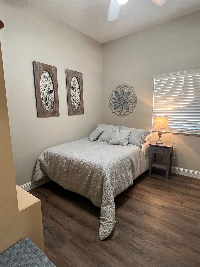 Newer, comfortable bed. Ceiling fan, clothes hangers, storage, laundry basket.