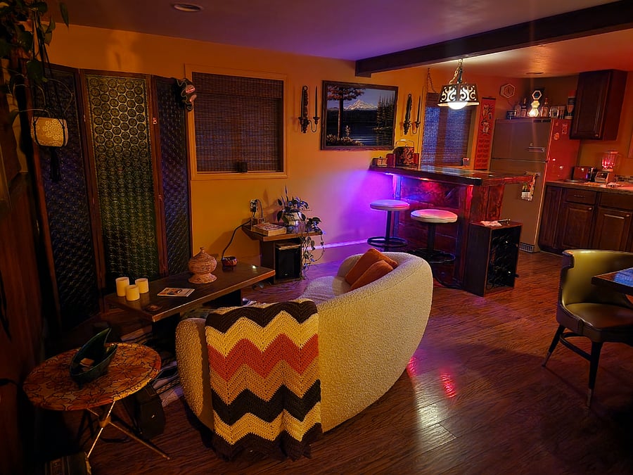 Come home and relax in this throwback living room that is like stepping back in time. Pour yourself a Coors and binge watch some Charlie's Angels.
