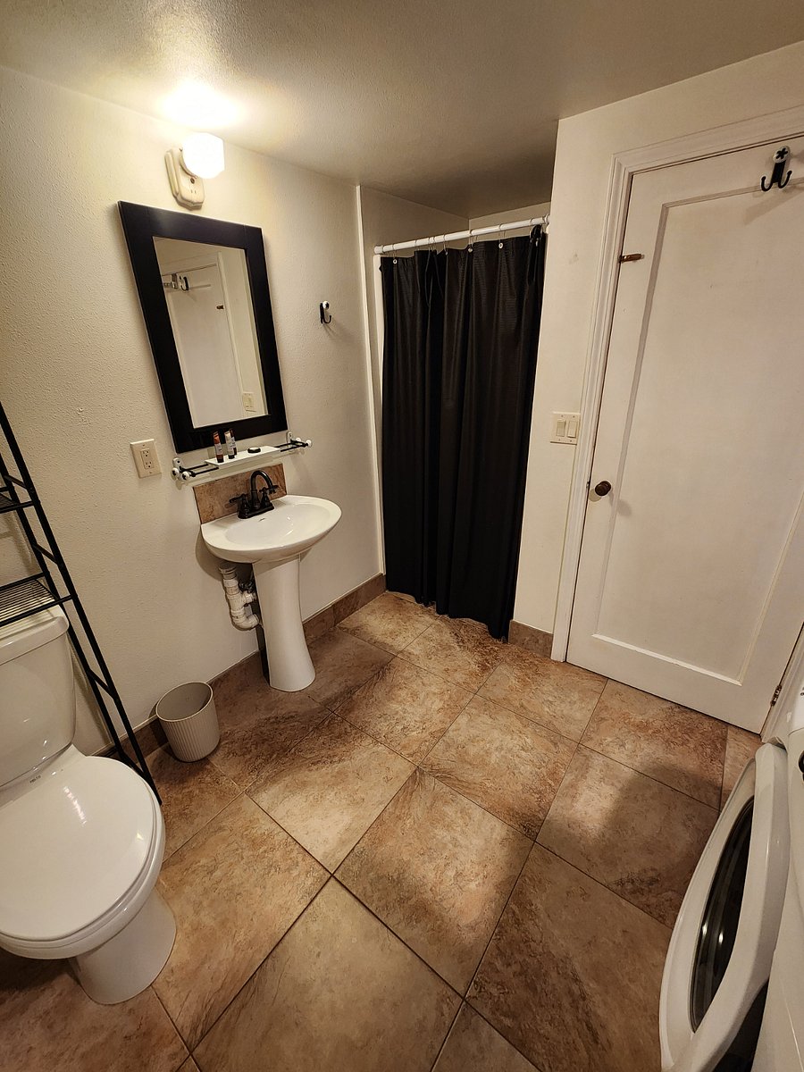 Large & roomy bathroom also has a full size washer & dryer.