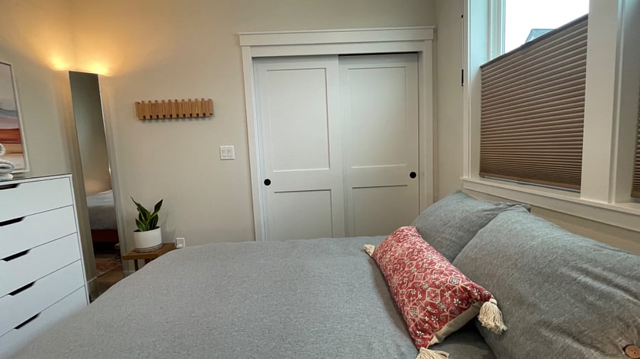 Modern coat/hat rack and dimmable mirrored light.