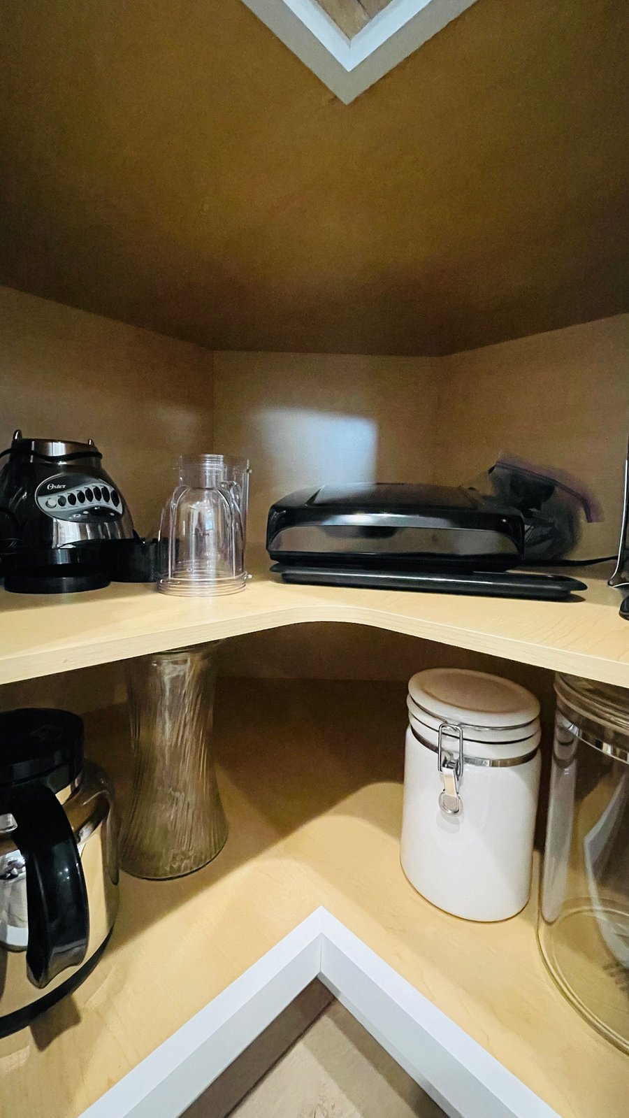 George Foreman grill and panini maker, Magic Bullet, blender, coffee carafe and storage containers.