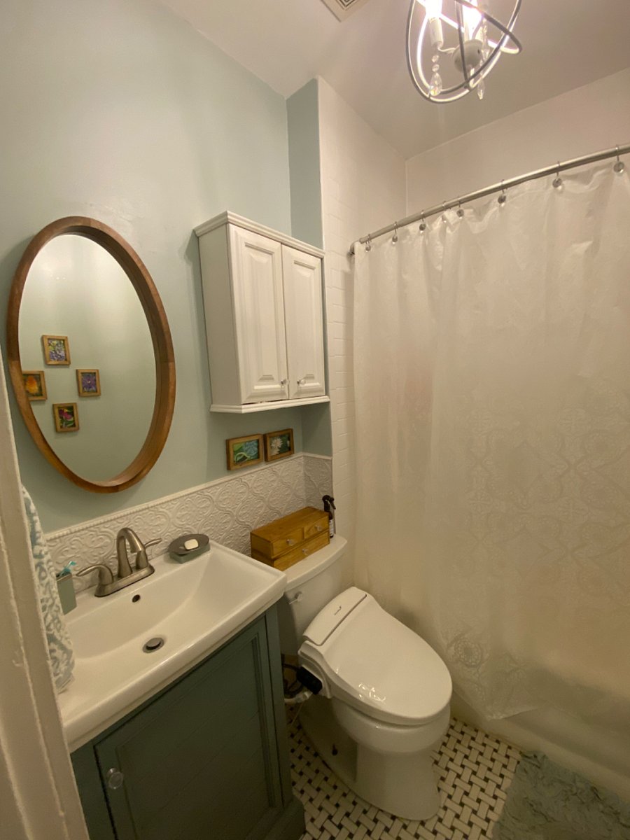 White bath with heated bidet toilet seat.