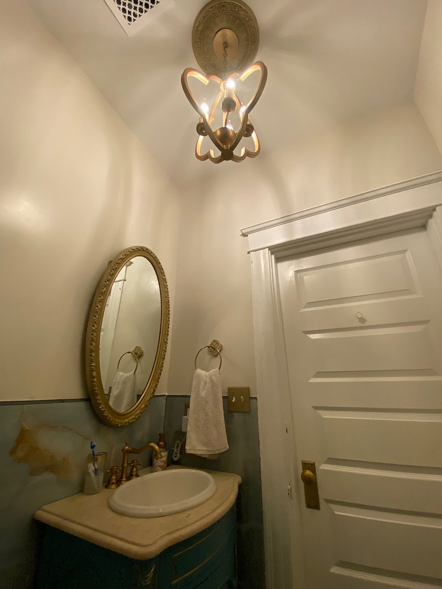 Gold spa bath with smart bidet toilet and jetted tub.