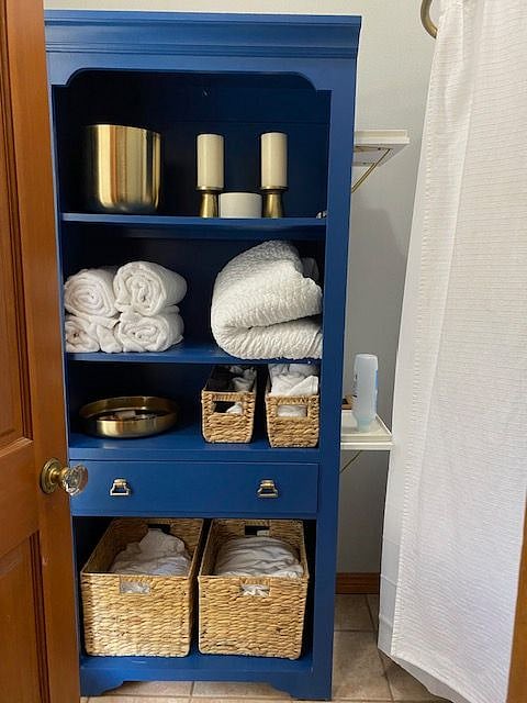 Plenty of storage in bathroom. Luxury towels and extra bedding