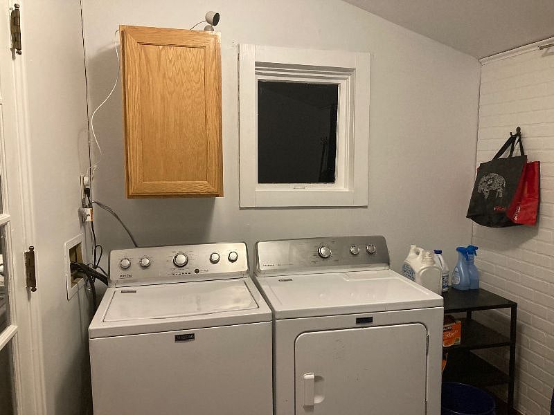 Full-size washer and dryer in laundry room just off the kitchen.