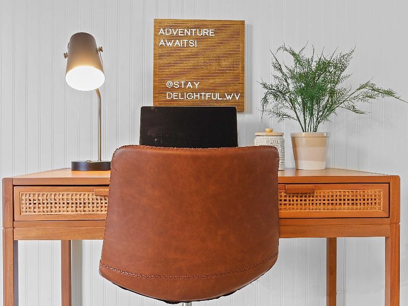 Ready for remote work? This home comes with its own dedicated office space, complete with a desk and chair, perfect for guests looking to stay productive while on the go.