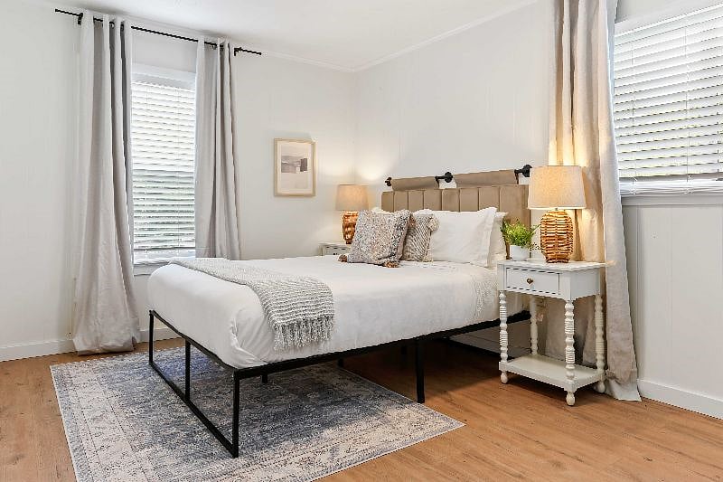 Experience a dreamy sanctuary in our cozy bedroom! With soft cotton linens, a spacious queen size bed, blackout curtains, and 2" privacy blinds, our stylish design will make you feel at home.