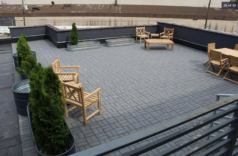 Shared deck area with grill and fire-pit
