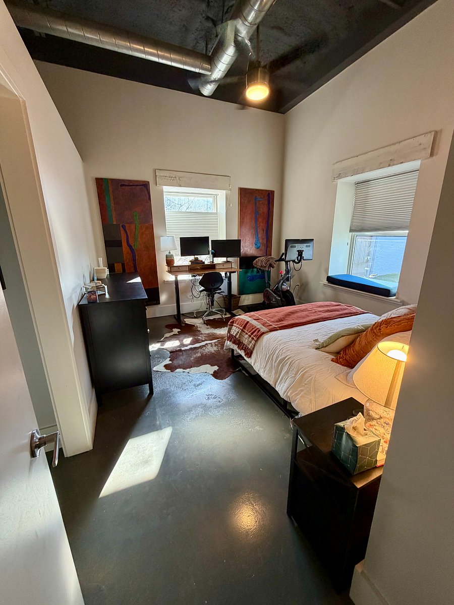 Primary Bedroom - includes stand-up desk and monitors for the perfect work from home setup. 