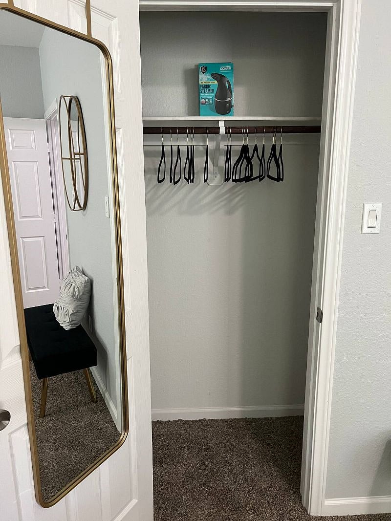 Spacious closet with full length mirror and steamer to get the wrinkles out! There is an iron and ironing board in laundry room.