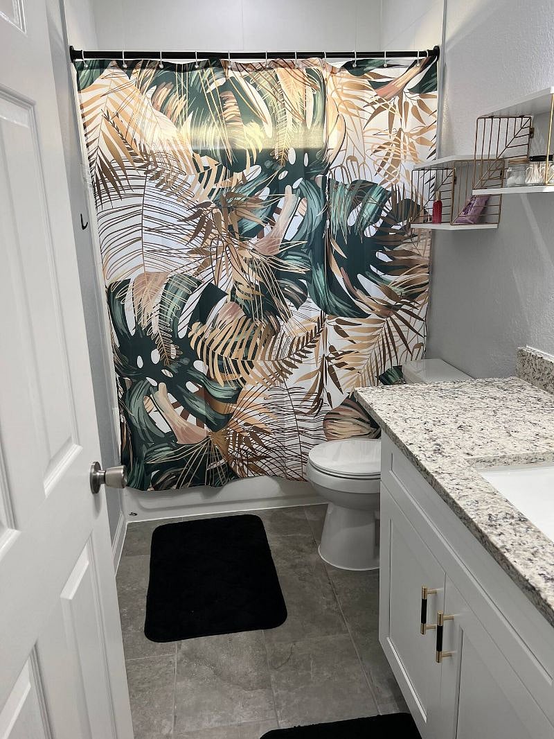 Beautiful bathroom with sink, toilet and bathtub/shower.