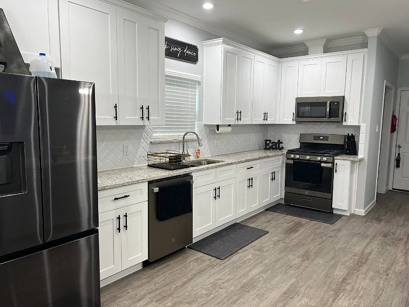 Fully furnished kitchen with stovetop and oven. There are plenty of dishes, silverware, pots, pans and seasonings for you to use.