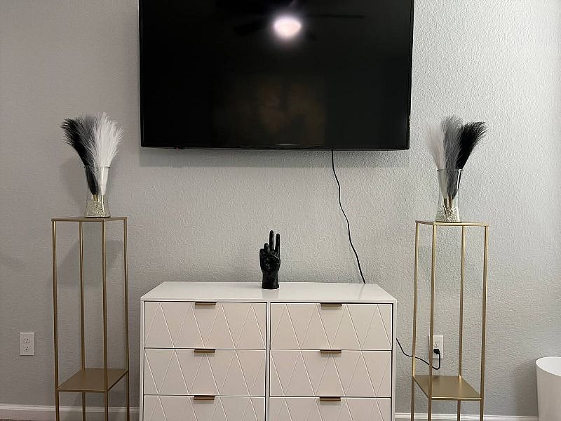 55" Smart TV and dresser.