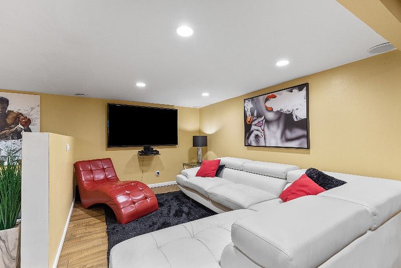 Basement sitting area. 70 inch television