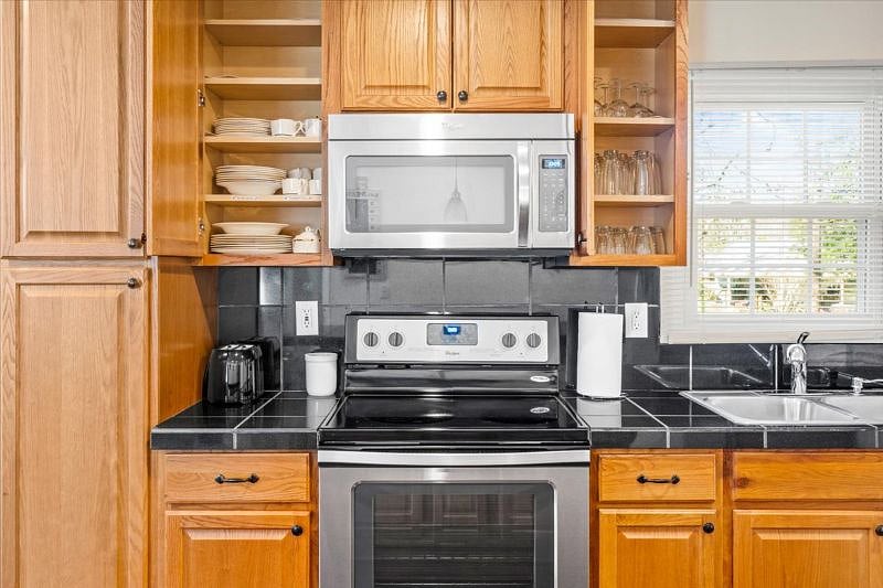 Glass top range, microwave and just some of the kitchen supplies!