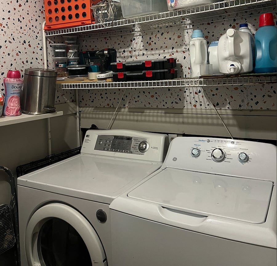Laundry room equipped with detergent, softener beads, sanitizer and dryer sheets.
