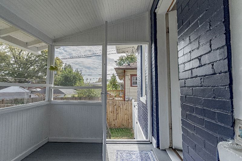 Elevated screened-in back porch.