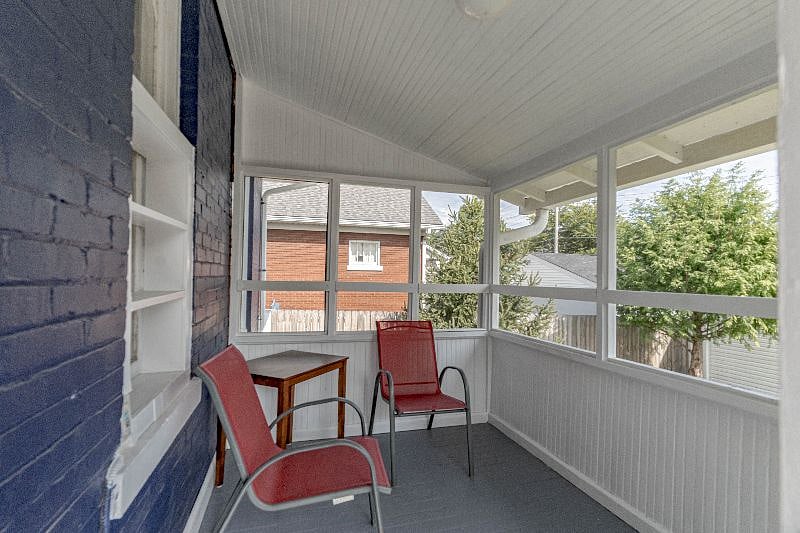 Elevated screened-in back porch.