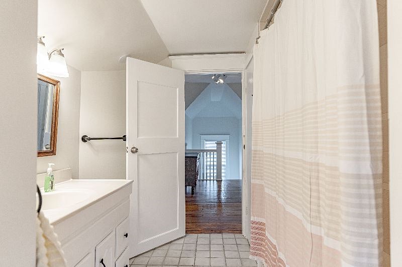 There is a 2nd vanity sink to the left in this photo and the toilet is to the right.