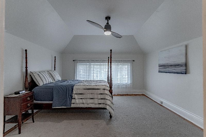Bedroom #3 on 2nd floor/ backside of house with 3 light sliding windows overlooking backyard.