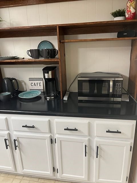 Coffee bar, hot tea pot, and microwave