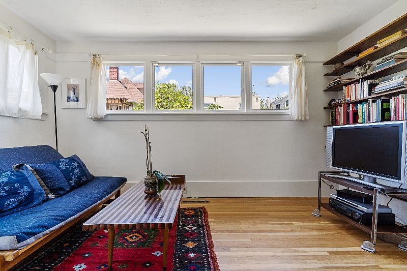 Tranquil TV  Room With Many Books to Peruse