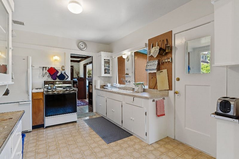 Fully-Stocked Kitchen With Backyard View
