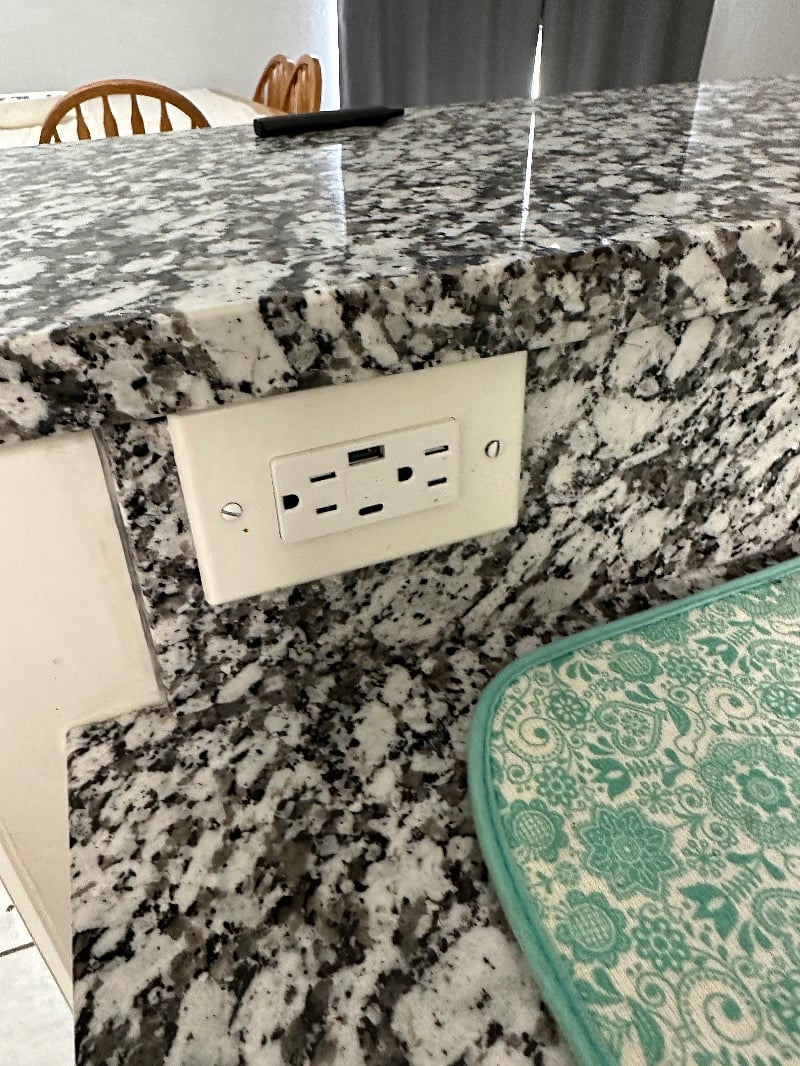 Some of the outlets have the new iPhone charging port and the usb port. This is located in the kitchen.