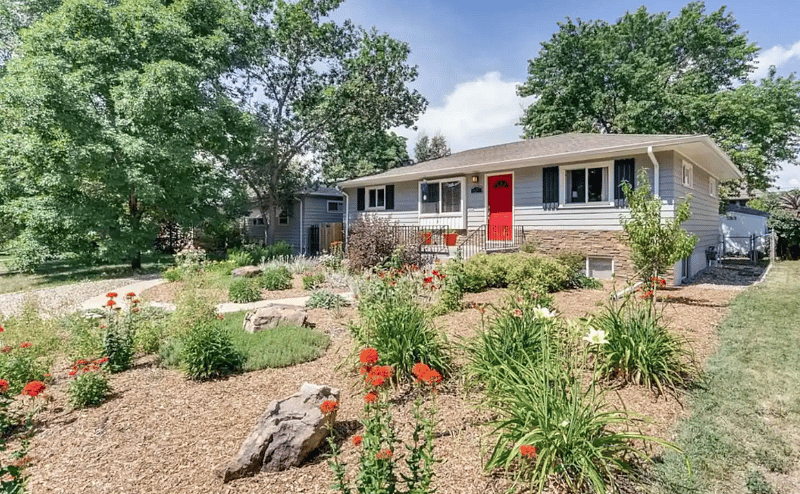 View of the front yard. Your entrance is following the left sidewalk.
