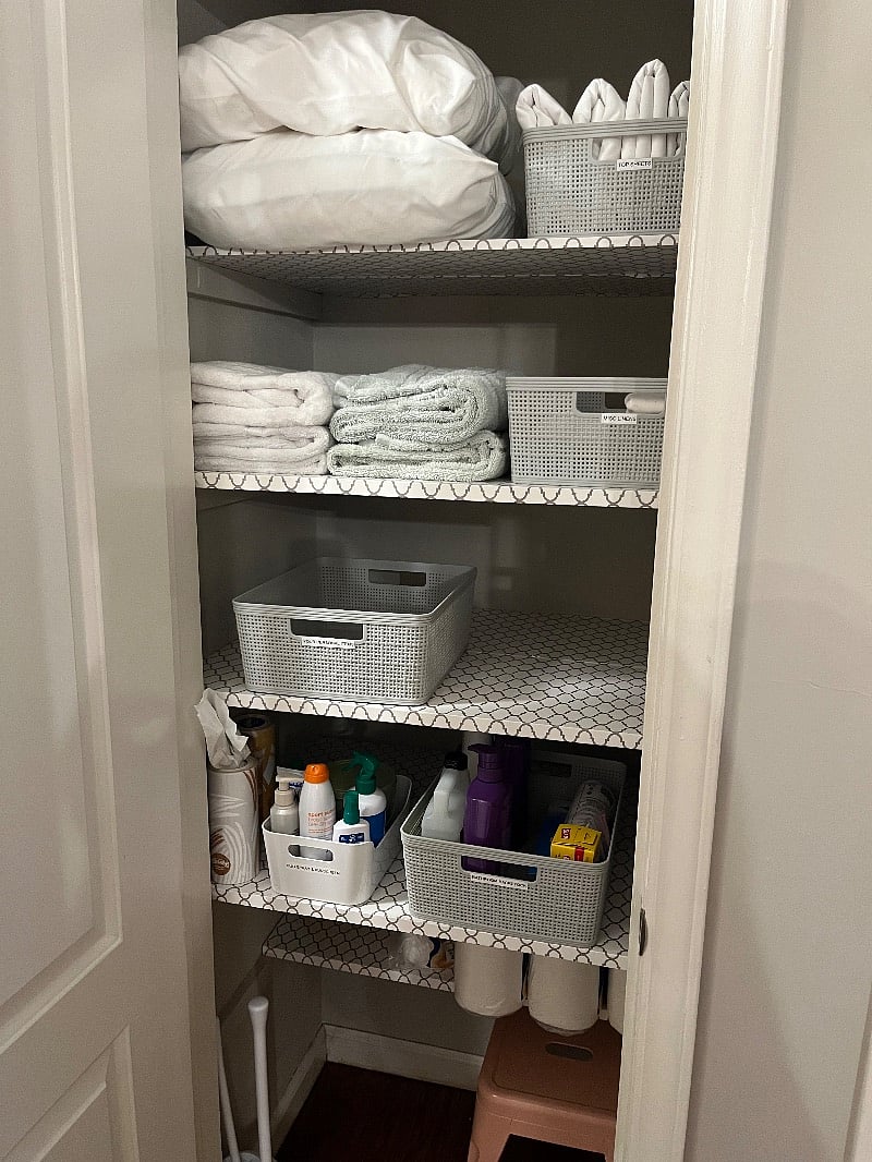 Linen closet with space left for your personal things.