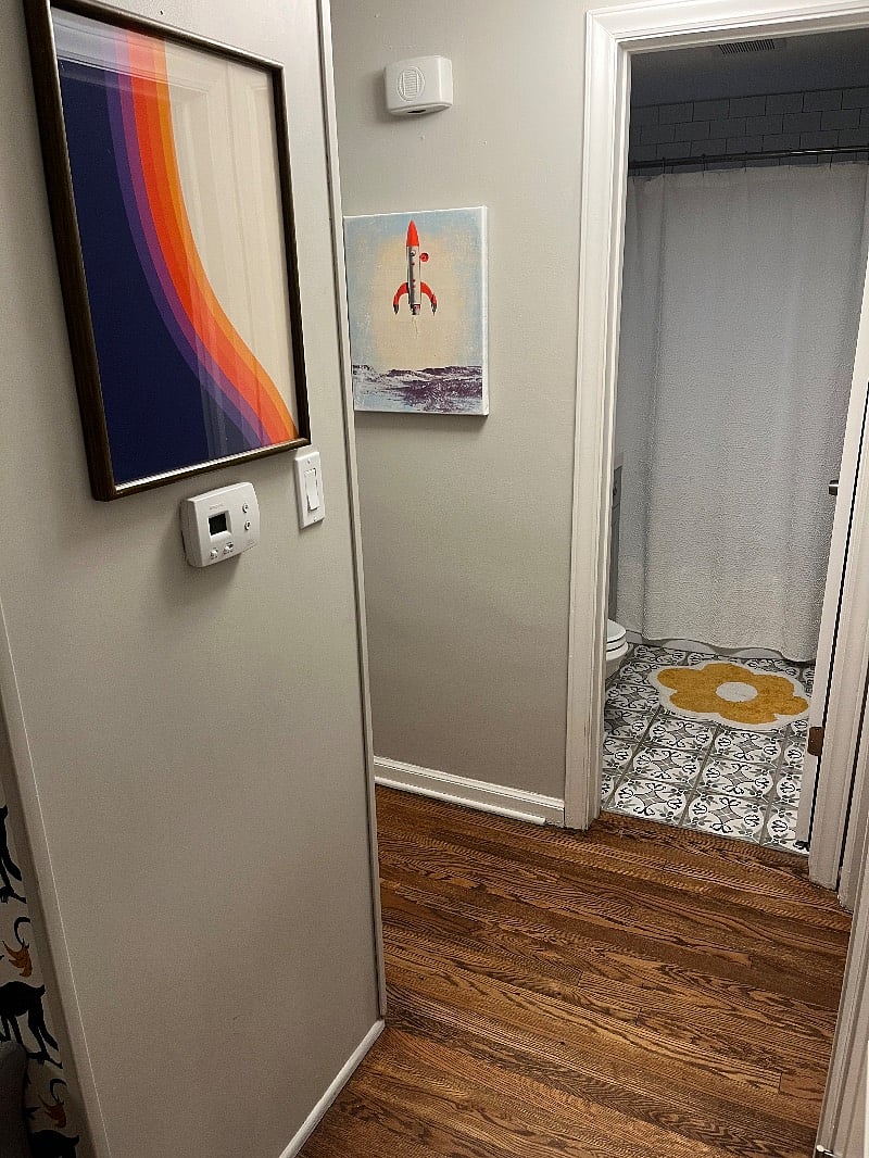 The hallway between bedrooms and bathroom. It loops around so nothing is cut off.