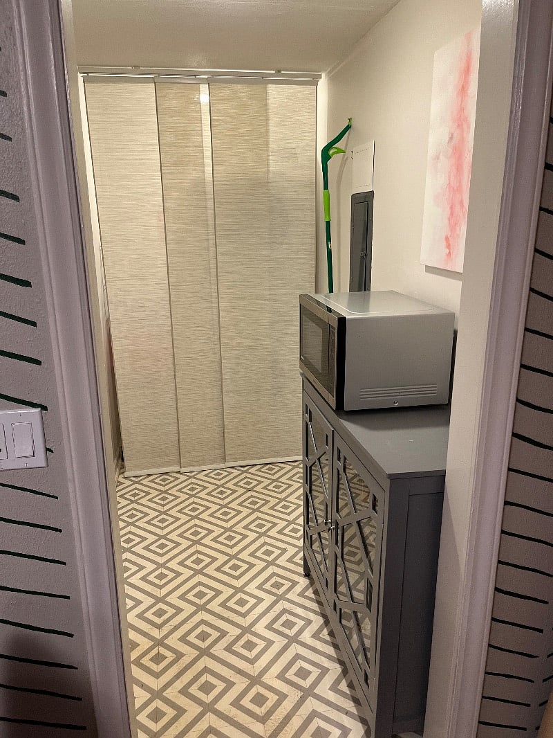 Laundry room with appliances hidden.