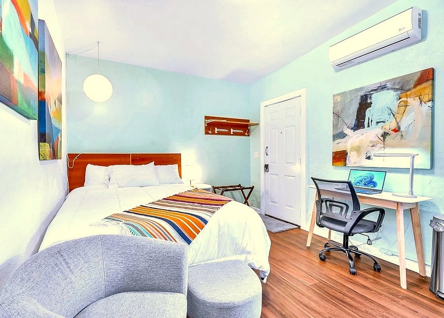 Sitting chair and ottoman, sloped ceiling and stylish decor. Luggage rack, shelf, hat/bag hooks and clothes hangers.