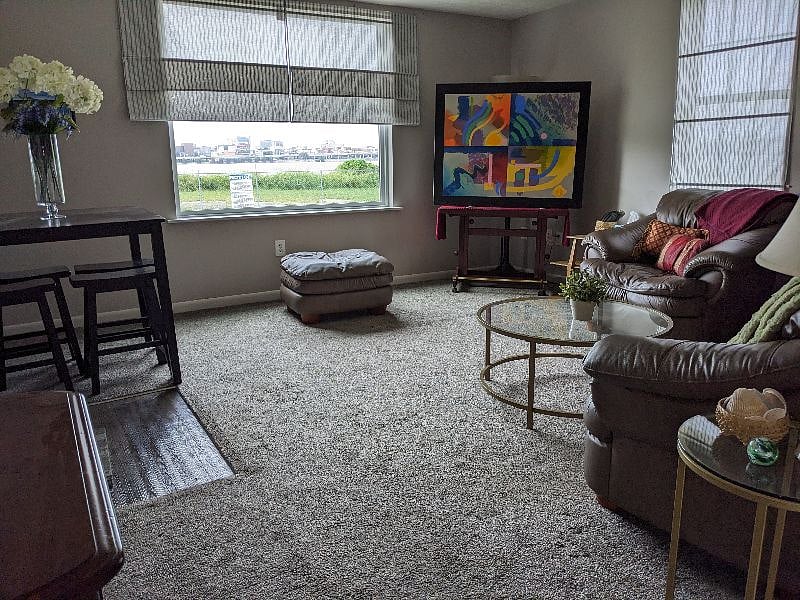 Living room is spacious and welcoming.