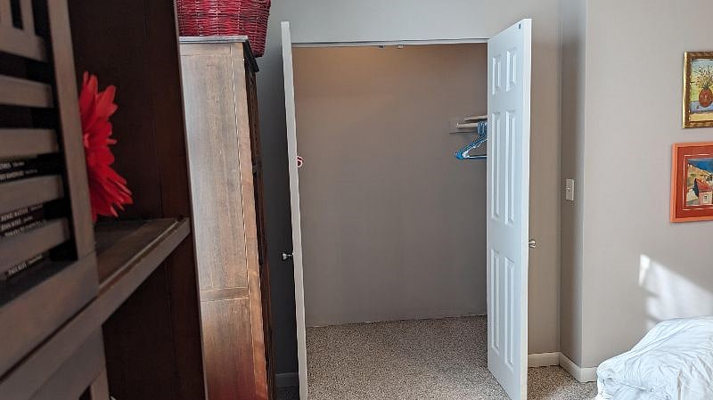 Br #2 has deep double-sided closet with rods on both sides