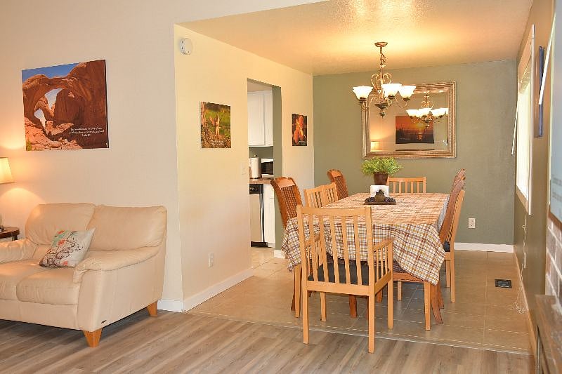 Dinning room with 10 chairs.  2 additional arm chairs are in the family room.