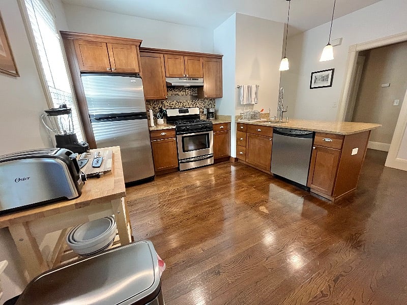 Large eat-in kitchen with granite counters and stainless appliances. Fully equipped.