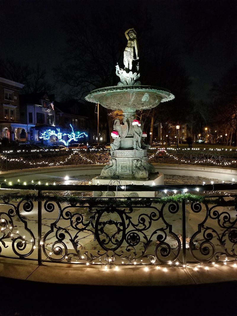 The iconic Saint James Court fountain in front of the home. Our home is the home with the lit up tree in the background. The carriage house is behind our home in the backyard/alley.