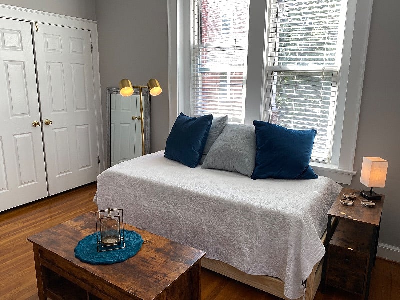 Double door closet features multiple organizational components for efficient storage of all clothing options.