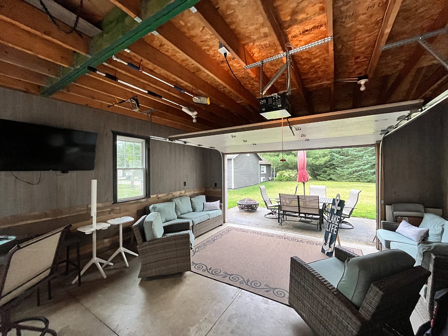 Garage set up as lounging area but room to park for winter, automatic garage door opener, garage connected to home