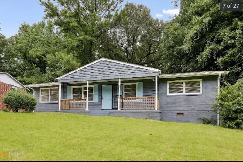 Exterior of house, large front porch and yard