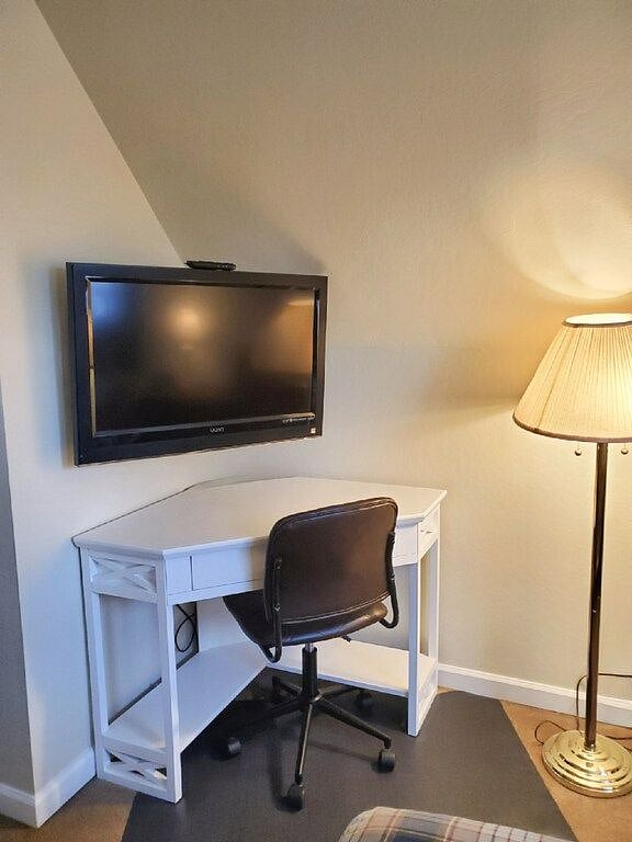 work space and tv in upstairs king bedroom