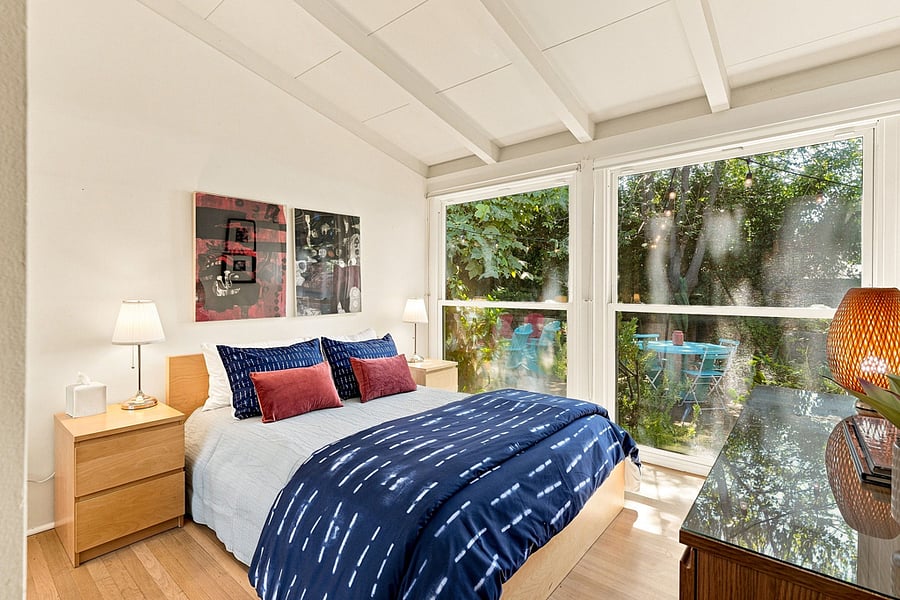 Bedroom 2 has a full size double bed and two bedside cabinets.