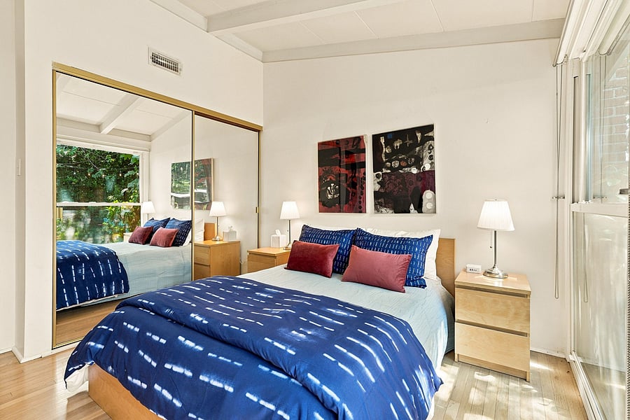 The large mirrored closet also has built in shelves, ideal for shoes. A power station to charge electronics is located on the bedside cabinet by the window.