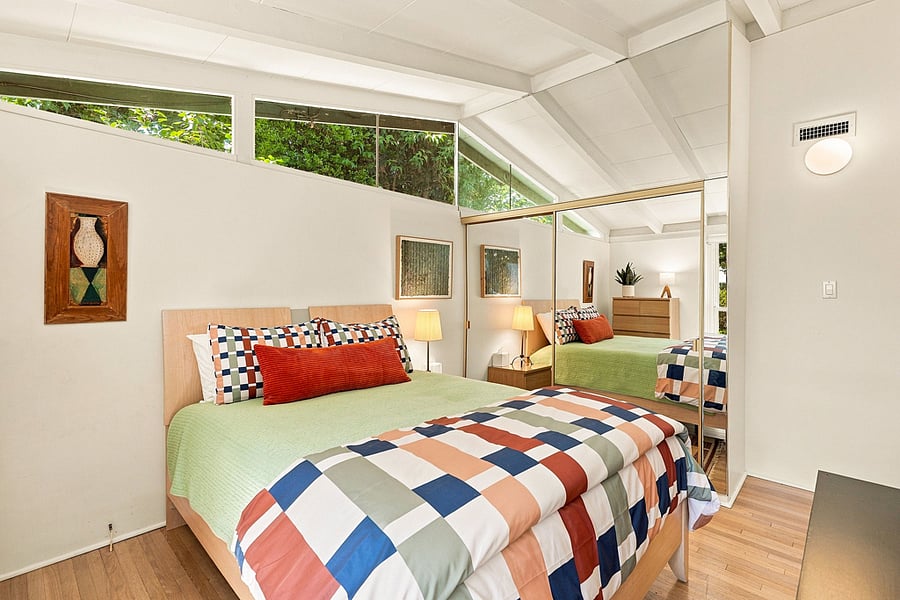 A large closet with mirrored sliding doors provides lots of space for your clothes.
