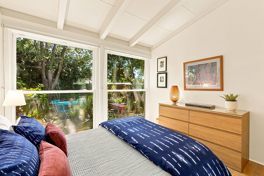 The dresser and bedside cabinets provide ample storage.
