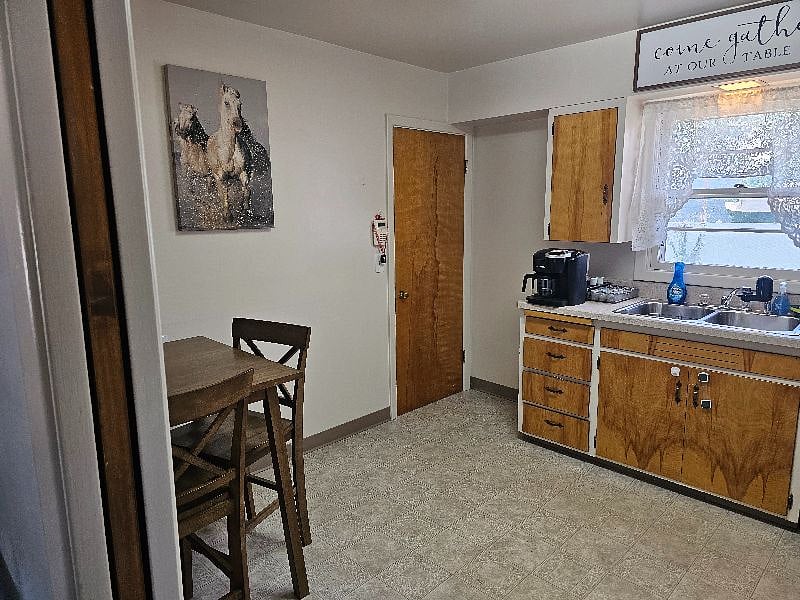 Kitchen has a breakfast nook for casual dining or work space.